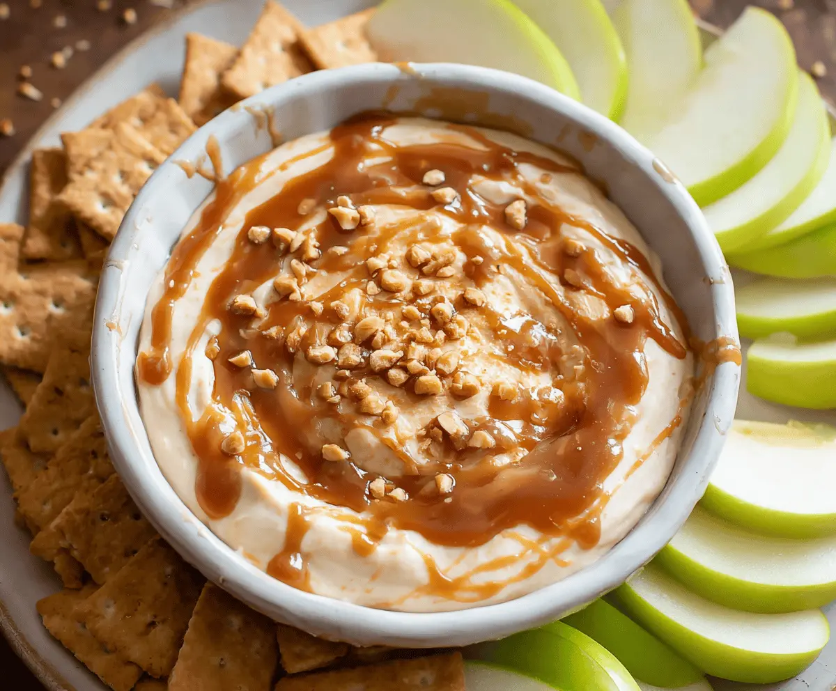 Delicious caramel apple dip served with fresh sliced apples for a sweet and creamy treat