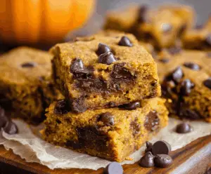Delicious pumpkin chocolate chip bars fresh out of the oven, perfect for fall desserts.