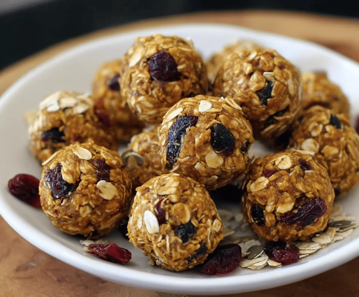 Healthy Pumpkin Cranberry Energy Bites made with oats, nuts, and natural sweeteners for a nutritious snack