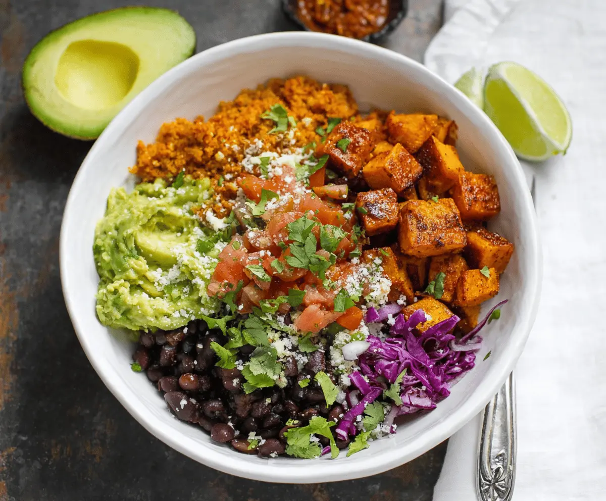 Delicious chipotle sweet potato burrito bowls topped with fresh cilantro and creamy avocado.