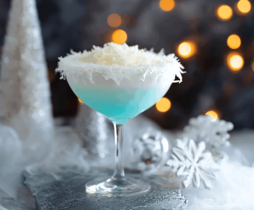 Elegant Christmas Snowflake Cocktail with sparkling ice and festive garnishes.