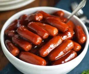 Delicious Crock Pot Little Smokies appetizer with smoky sausage links in a slow cooker