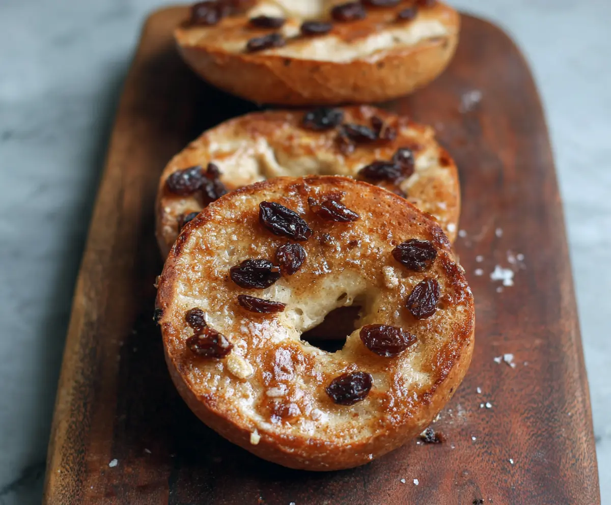 Delicious 5-ingredient cinnamon raisin Greek yogurt bagels on a plate, perfect for breakfast or snacks.