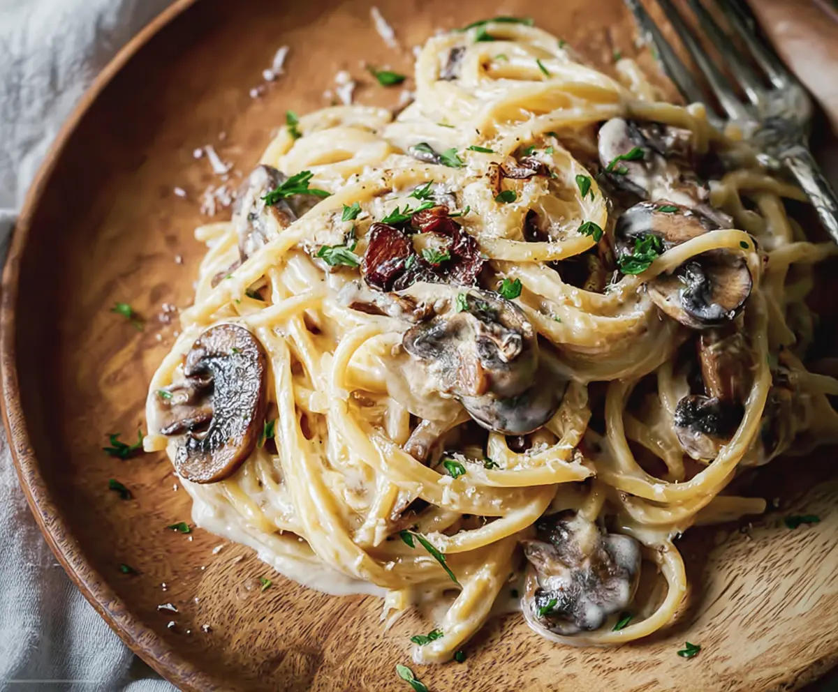 Delicious truffle mushroom cream pasta served on a stylish plate, perfect for a gourmet dinner.