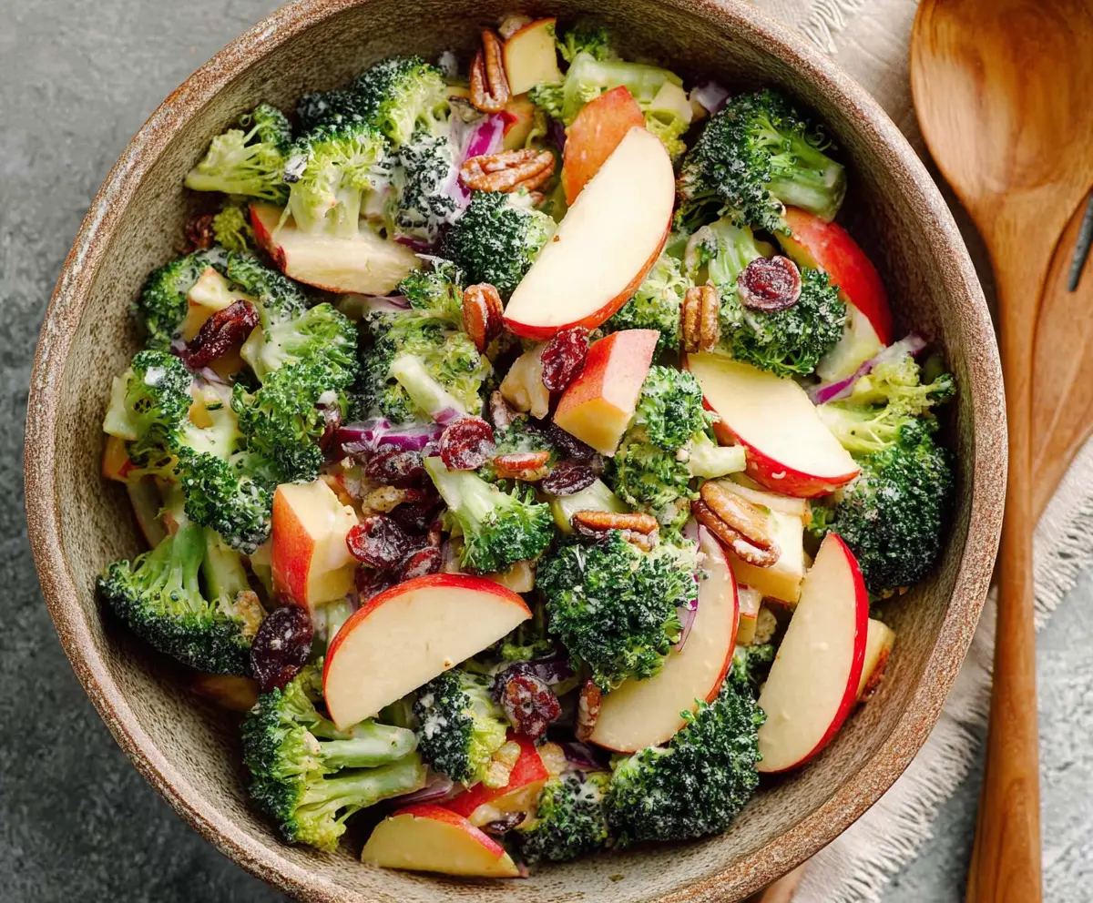 Fresh broccoli and apple salad in a bowl, healthy and colorful vegetarian dish.
