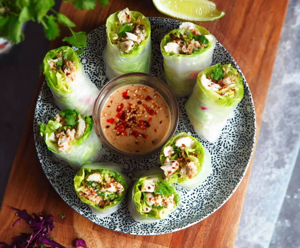 Delicious Caesar Chicken Rice Paper Rolls with fresh ingredients and creamy dressing