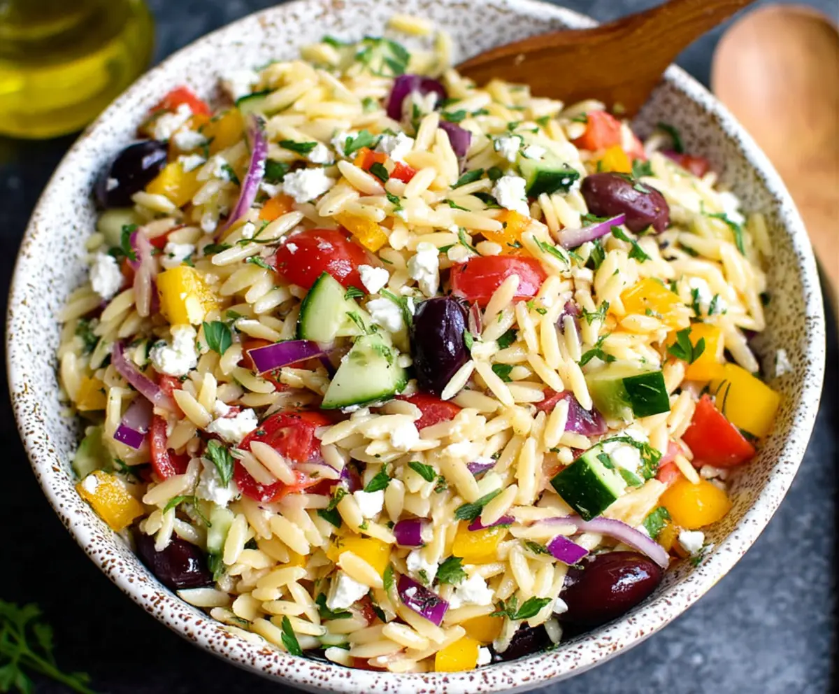 Refreshing Greek Orzo Salad with fresh vegetables and feta cheese, perfect for summer meals.