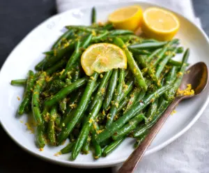 Fresh Lemon Green Beans dish served on a rustic plate, showcasing vibrant green beans glazed with lemon zest.