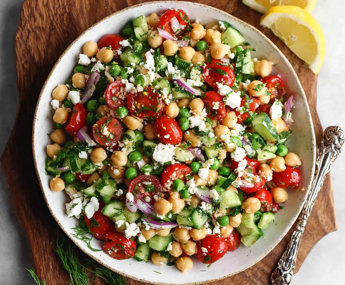 Fresh Mediterranean Pea Salad featuring vibrant greens, chickpeas, and feta cheese in a light vinaigrette.